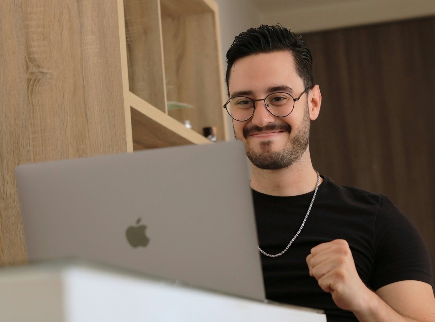 Small business owner reviewing website updates on a laptop